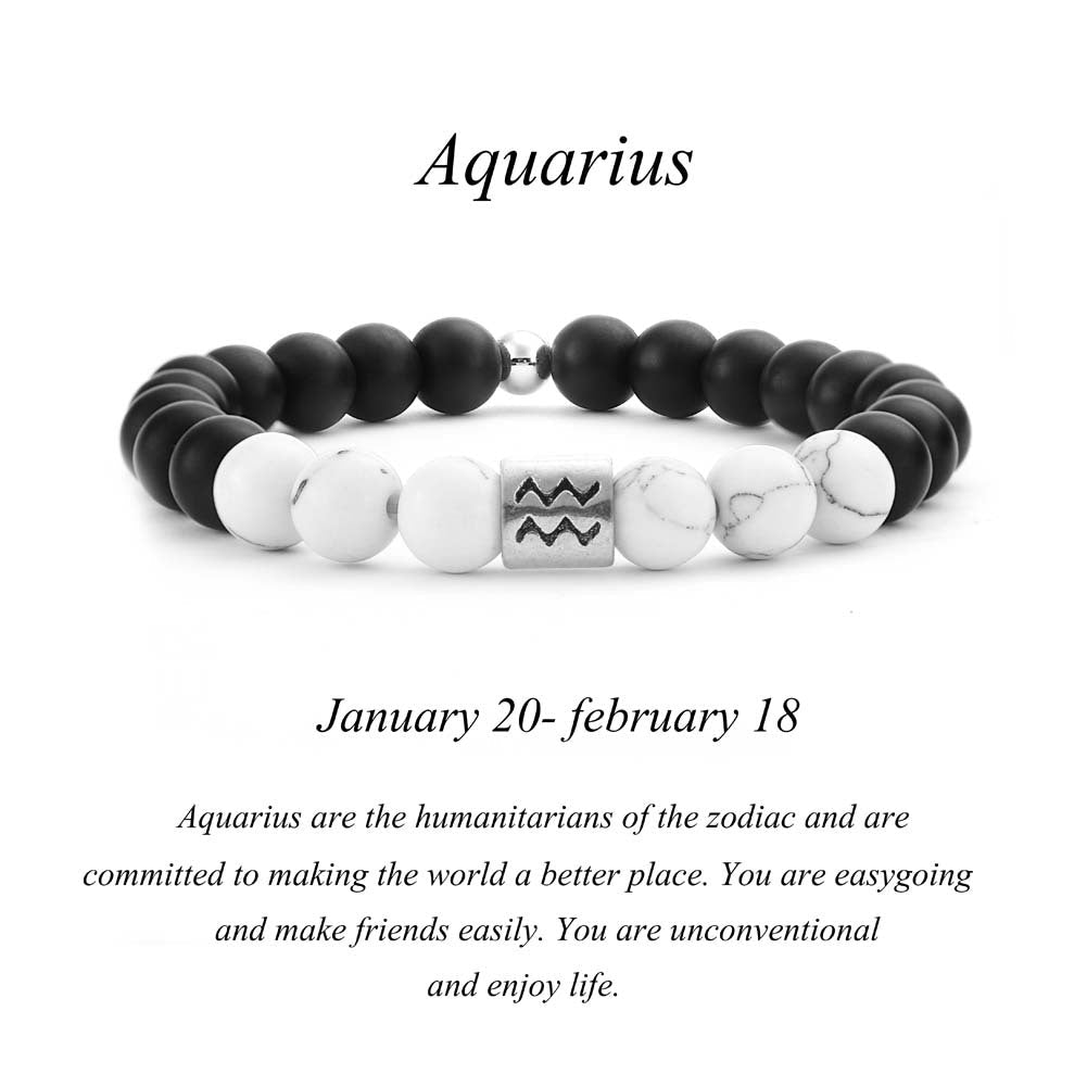 Black and white beaded bracelet with Aquarius symbol on a white background