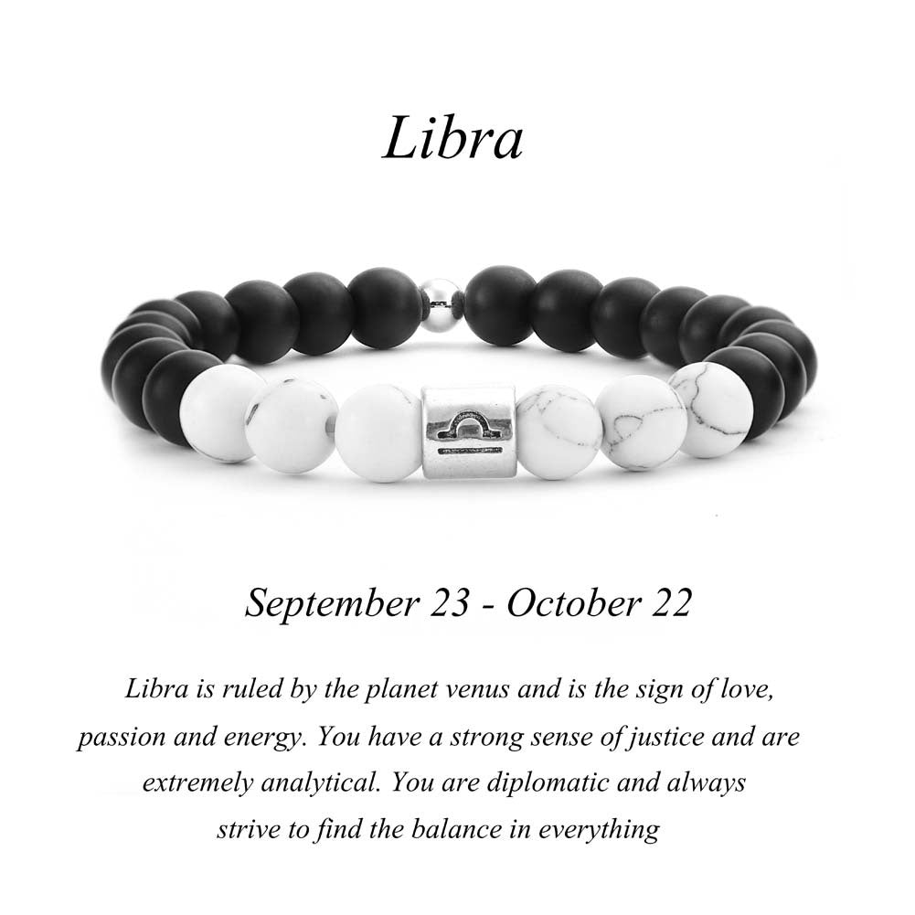 Libra zodiac bracelet with matte black Agate and white Howlite beads and a silver Libra scales charm on white background