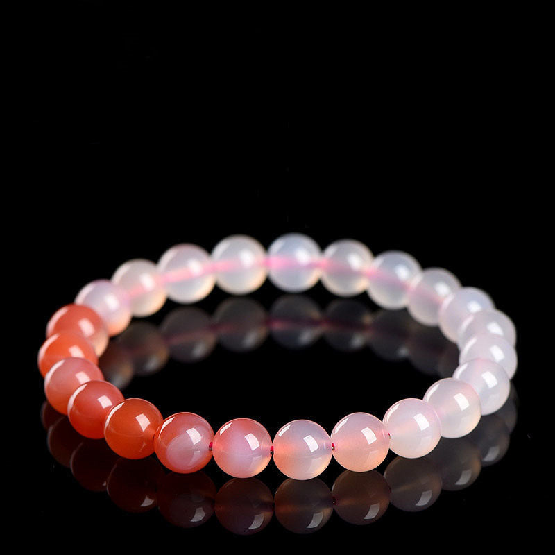 Beaded bracelet with gradient colors on a black background