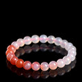 Beaded bracelet with gradient colors on a black background
