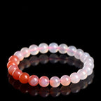 Beaded bracelet with gradient colors on a black background