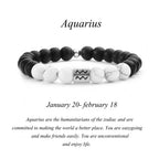 Black and white beaded bracelet with Aquarius symbol on a white background