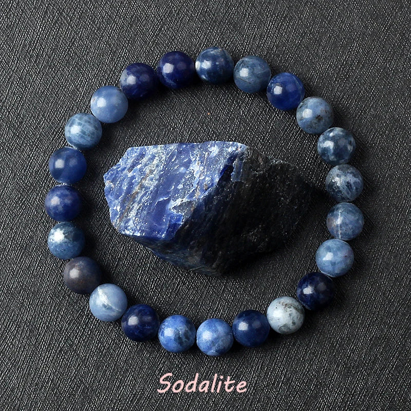 Blue sodalite bead bracelet on a dark gray background with sodalite stone.