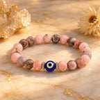 Agate evil eye gemstone bracelet with soft pink beads, stylish energy jewelry for peaceful daily styling
