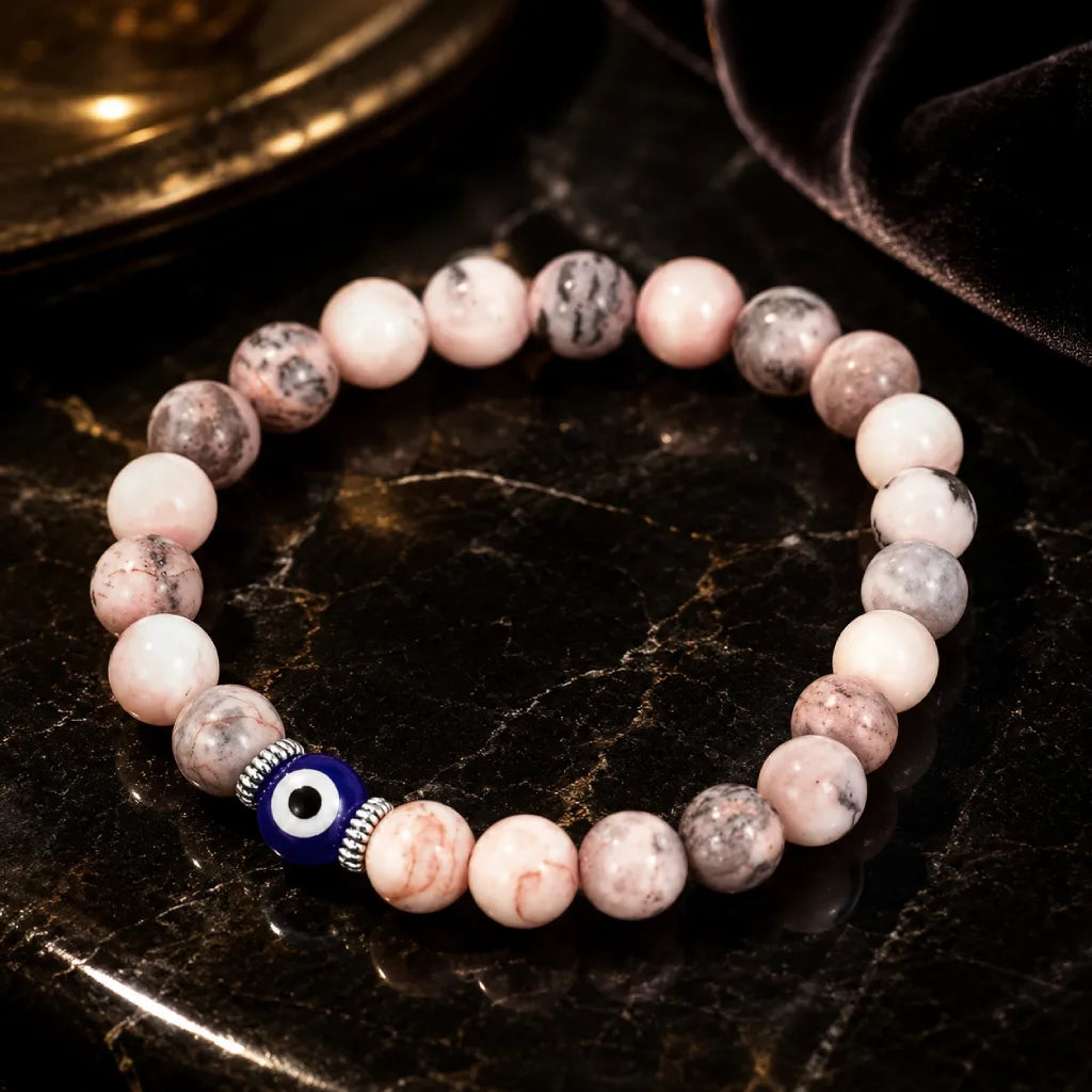 Agate evil eye healing bracelet worn during journaling, calming spiritual jewelry for mindful daily rituals