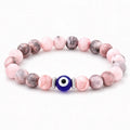 Agate evil eye crystal bracelet with pink gemstone beads, calming spiritual jewelry for balanced energy