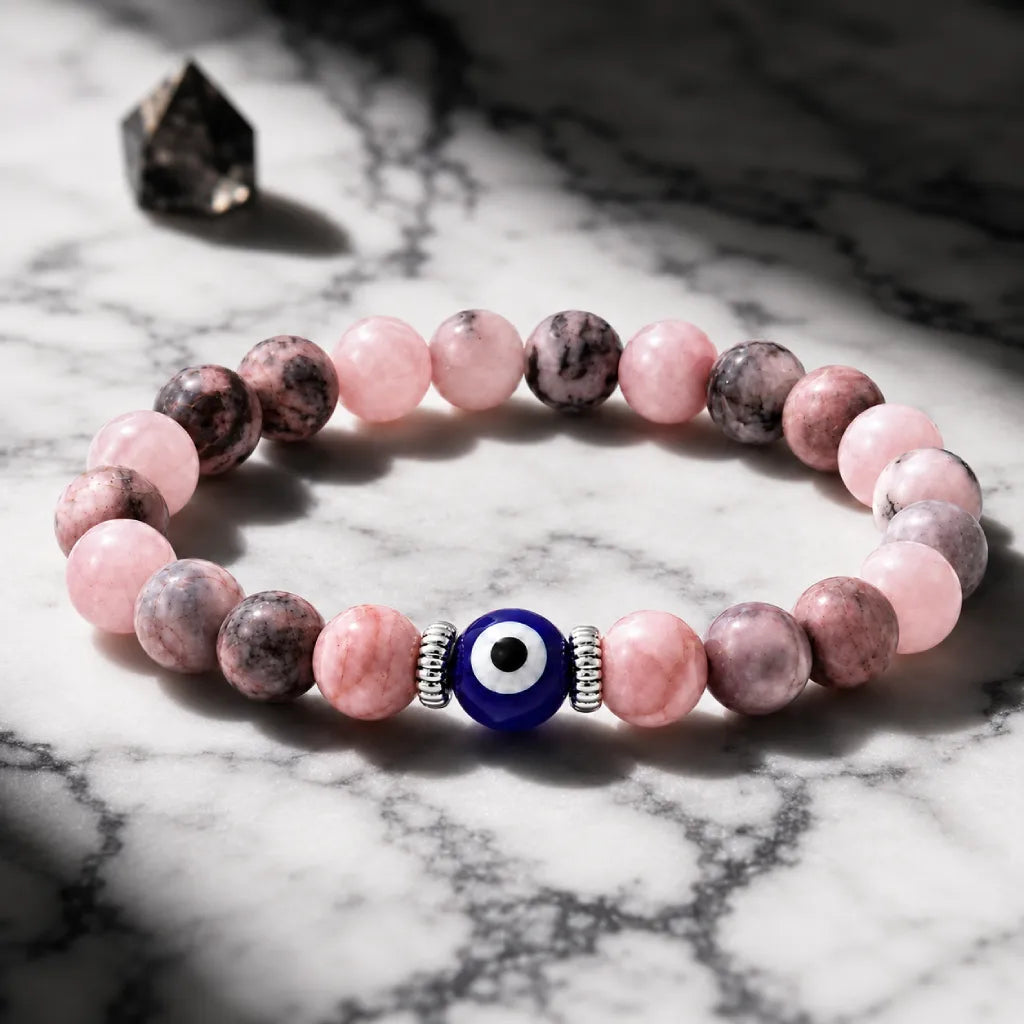 Agate evil eye bracelet with pink gemstone beads and blue charm, spiritual protection accessory for positive energy