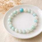 Amanzonite bracelet round bead bracelet on white plate with pastel blue green stones, elegant healing jewelry gift