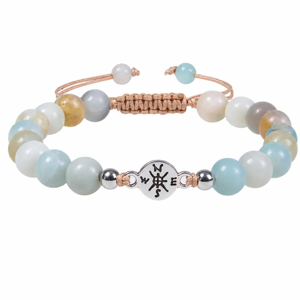 Amazonite crystal bracelet with polished aqua gemstone beads isolated on clean white background display.