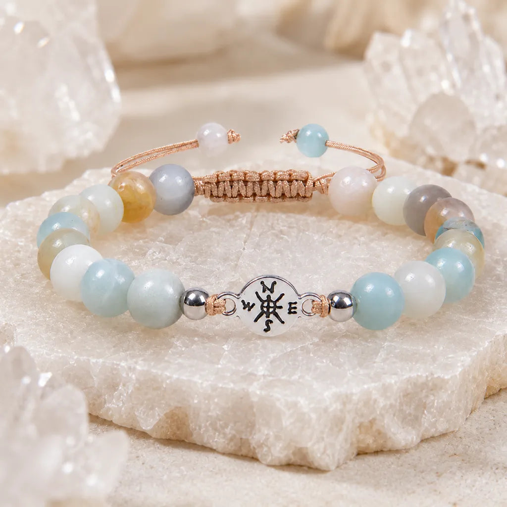 Amazonite crystal bracelet with calming blue gemstone beads and silver charm for spiritual balance and style.