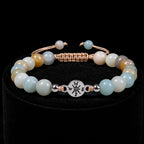 Amazonite gemstone bracelet with soothing aqua beads and silver centerpiece displayed on elegant black velvet.