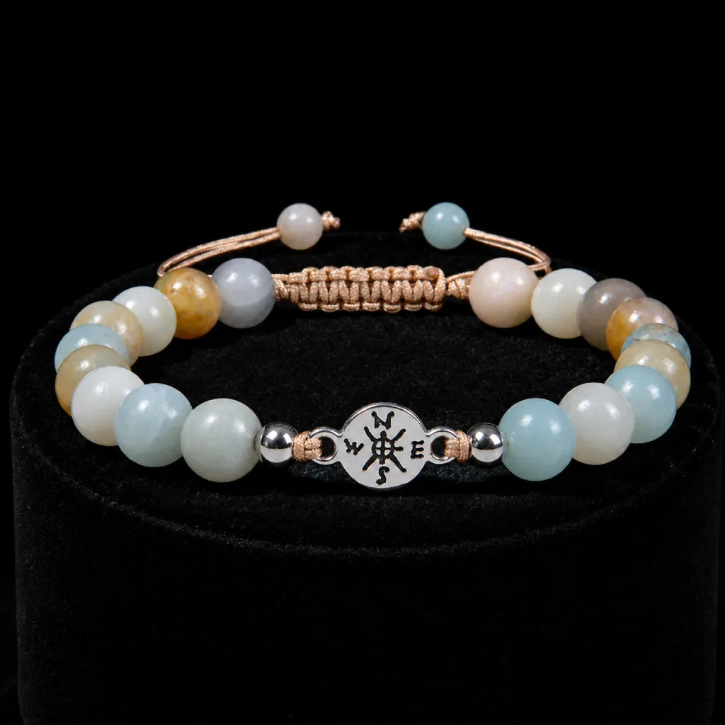 Amazonite gemstone bracelet with soothing aqua beads and silver centerpiece displayed on elegant black velvet.