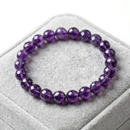 Amethyst bracelet on soft gray velvet box with faceted purple beads, refined crystal jewelry for elegant gifting