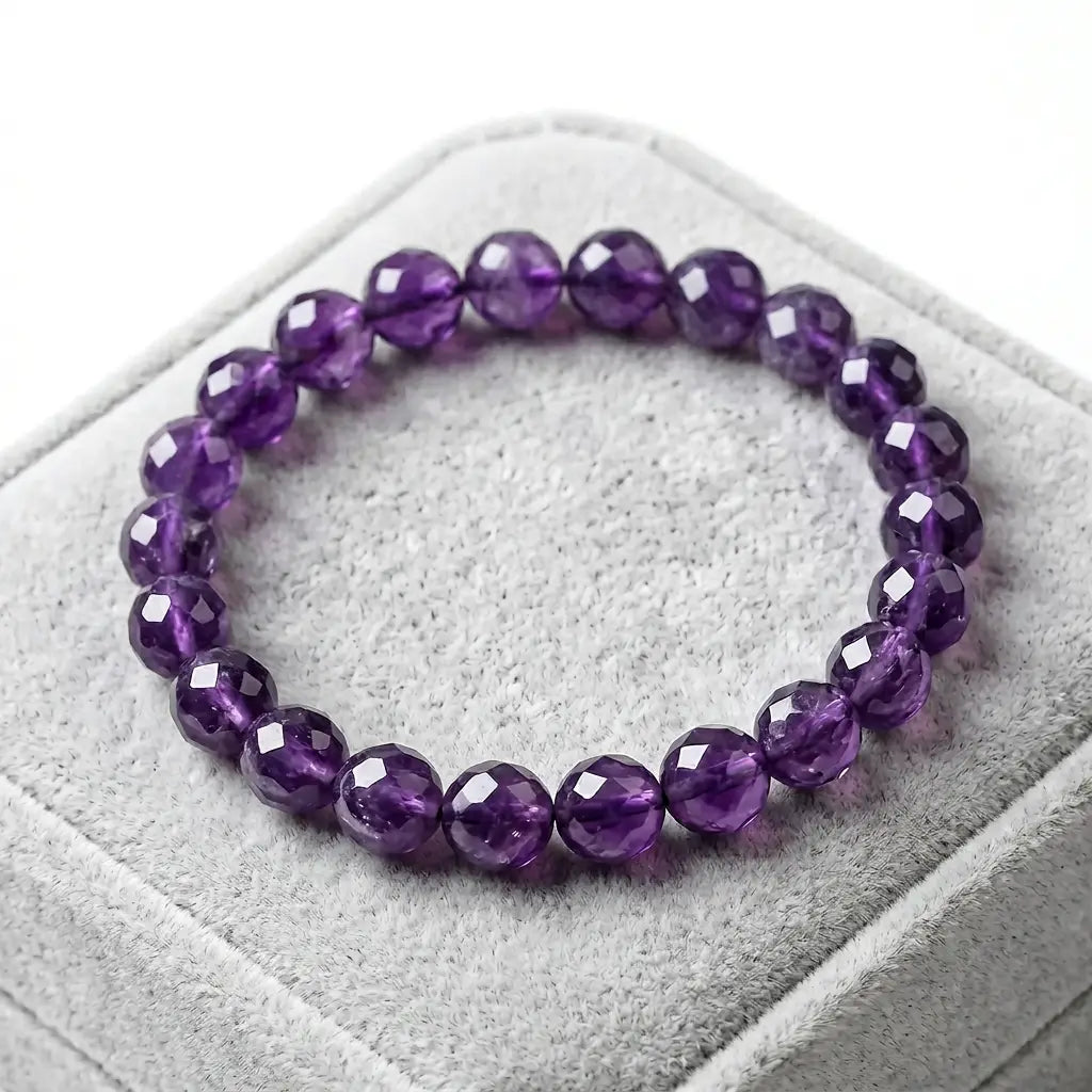 Amethyst bracelet on soft gray velvet box with faceted purple beads, refined crystal jewelry for elegant gifting