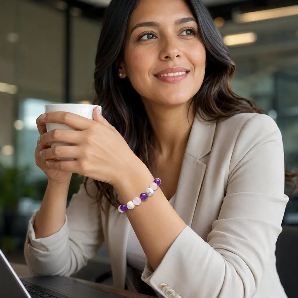 Amethyst rose quartz howlite bracelet styled with modern workwear showcasing elegant crystal jewelry and daily balance.