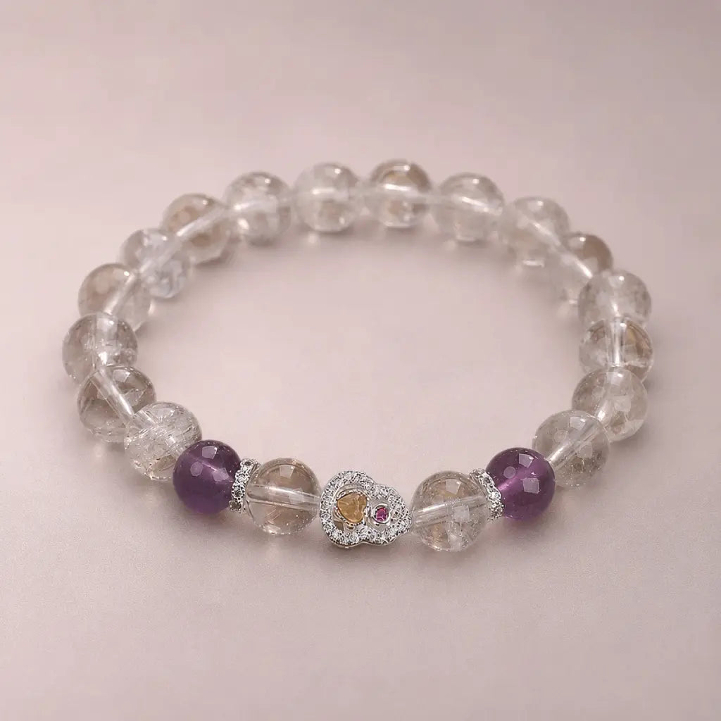 Crystal bead bracelet with amethyst details and healing stones creating peaceful luxury accessory appeal