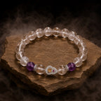 Crystal bead bracelet with amethyst accents and clear stones creating elegant healing jewelry appeal