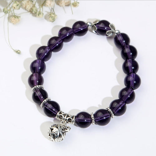 Violet Serenity amethyst bracelet with genuine natural purple beads in a polished stretch design, shown as simple gemstone jewelry for daily wear, mindful routines, and gift ideas.
