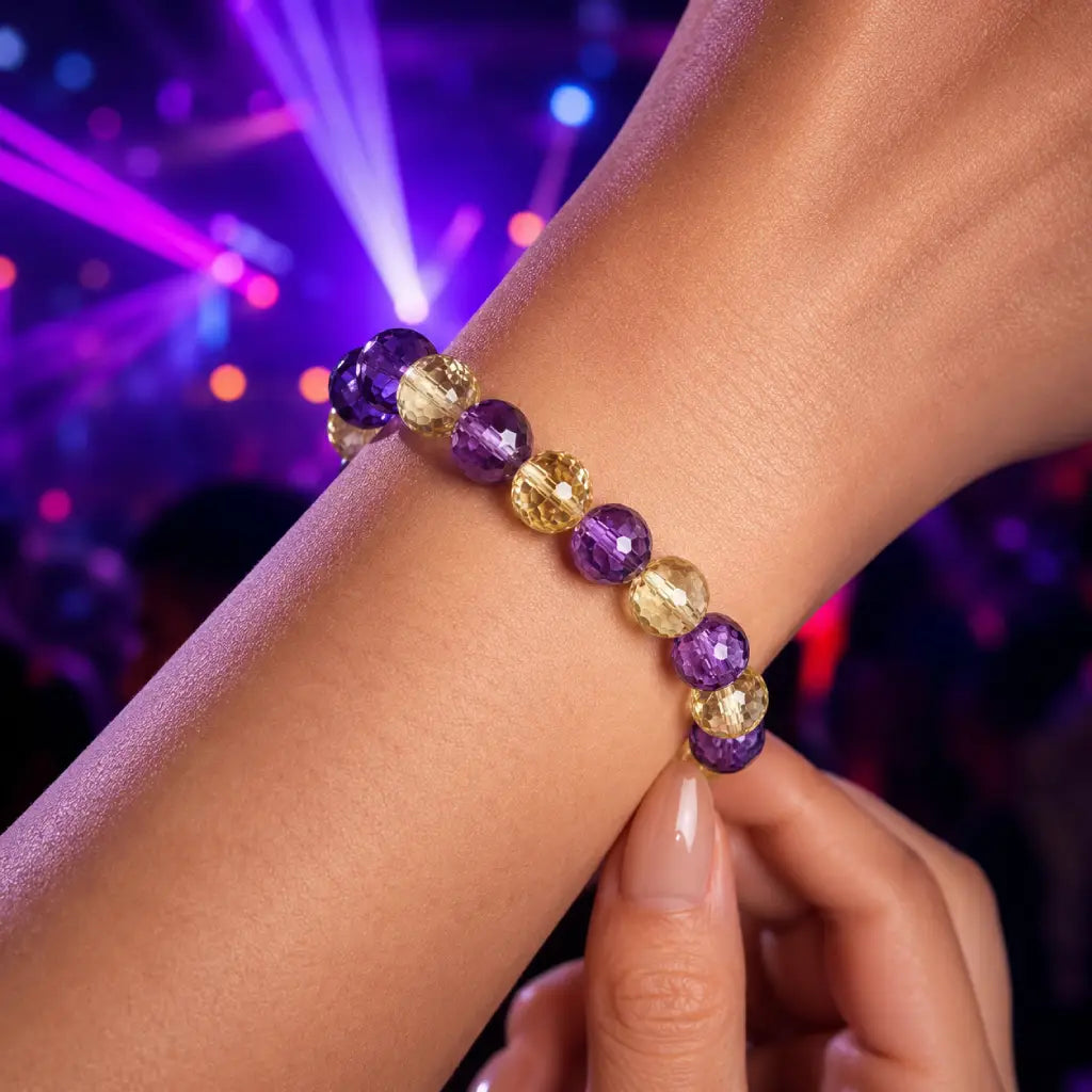 Amethyst citrine bracelet with faceted purple and gold crystal beads on wrist for elegant gemstone style