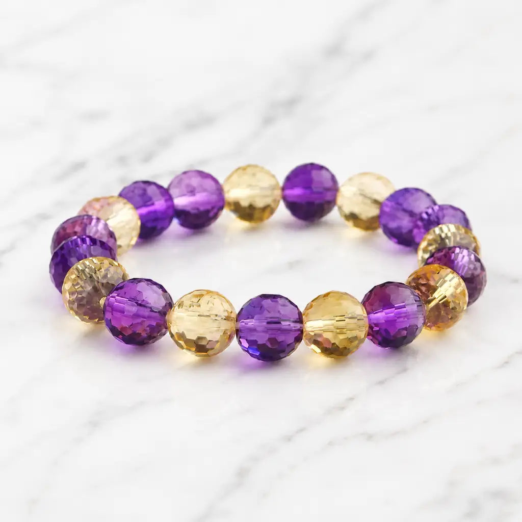 Amethyst citrine bracelet with purple and gold crystal beads emphasizing luxury gemstone craftsmanship