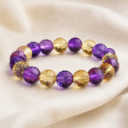 Amethyst citrine bracelet displayed on fabric with faceted gemstone beads creating premium visual appeal