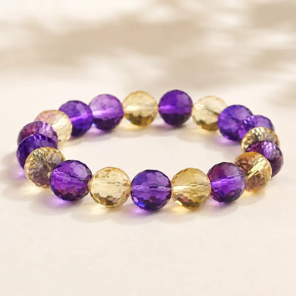 Amethyst citrine bracelet displayed with purple and gold faceted beads highlighting premium craftsmanship
