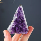 Amethyst Cluster held in hand featuring deep purple natural crystal points with raw quartz edges, ideal for crystal collection and home décor.