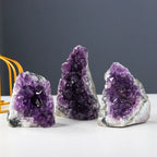 Amethyst Cluster trio displaying vibrant natural purple crystal geodes with sparkling quartz surfaces for luxury home décor and gifts.