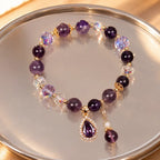 Amethyst crystal bracelet on mirrored display with faceted gemstone beads for elegant luxury appeal