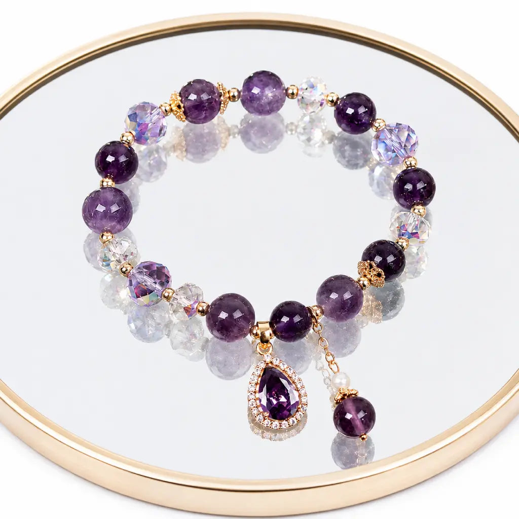Amethyst crystal bracelet with reflective display and purple gemstone beads for elegant luxury styling