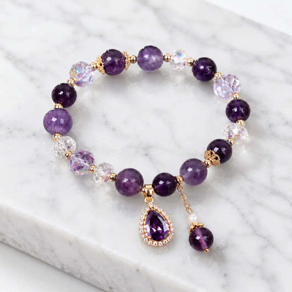 Amethyst crystal bracelet on marble surface with polished gemstone beads for timeless beauty appeal