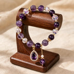 Amethyst crystal bracelet on wooden stand with faceted gemstone beads for premium jewelry appeal