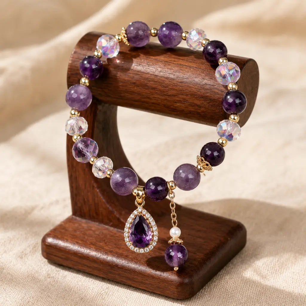Amethyst crystal bracelet on wooden stand with faceted gemstone beads for premium jewelry appeal