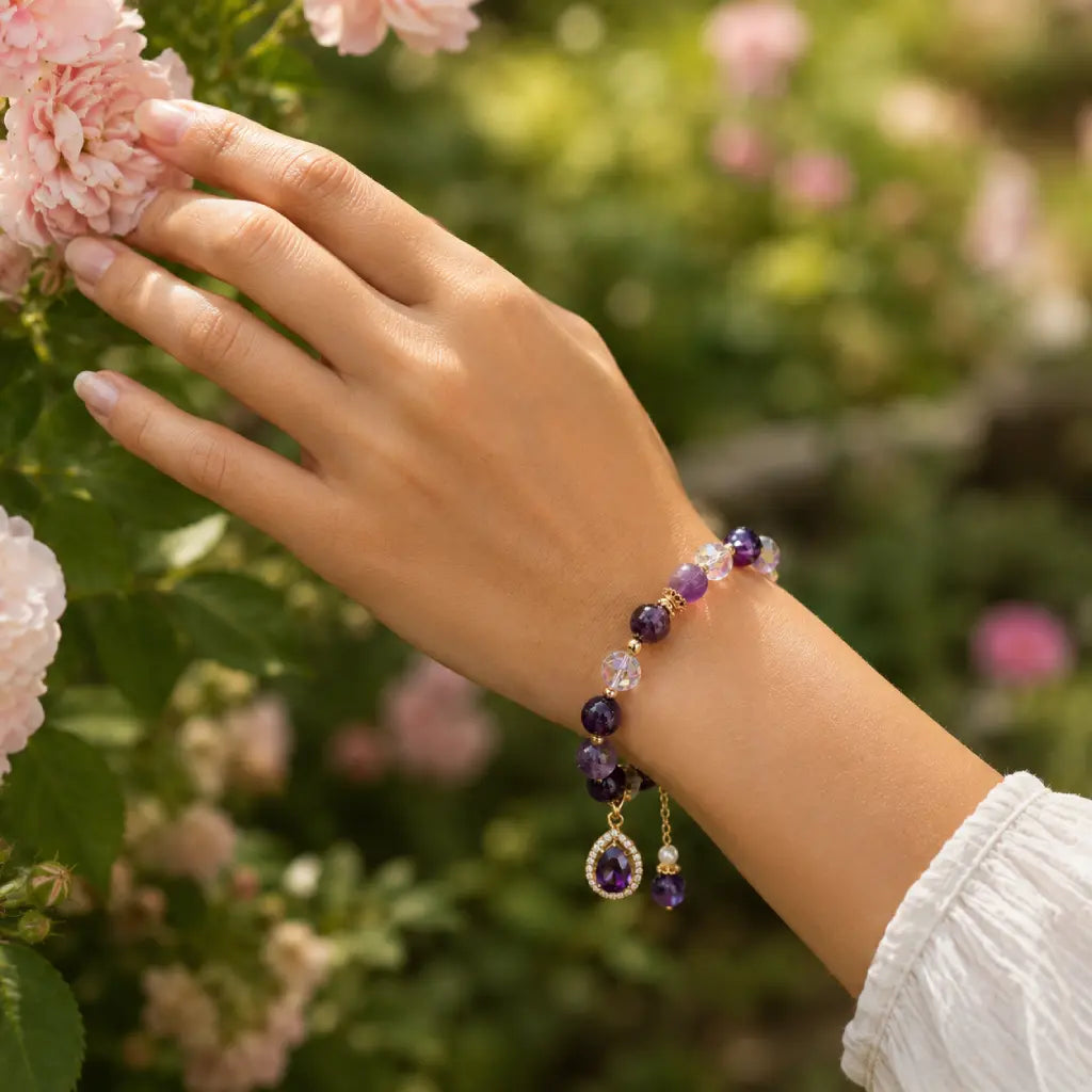 Amethyst crystal bracelet worn in garden setting with gemstone beads for elegant natural beauty