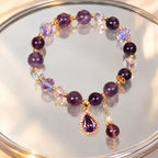 Amethyst crystal bracelet on reflective display with polished gemstone beads for luxury styling