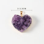 Amethyst heart pendant close-up with purple crystal points, heart shape, gold-color edging, small bail, and a measured width of approximately 3 to 3.5 centimeters, on white studio.