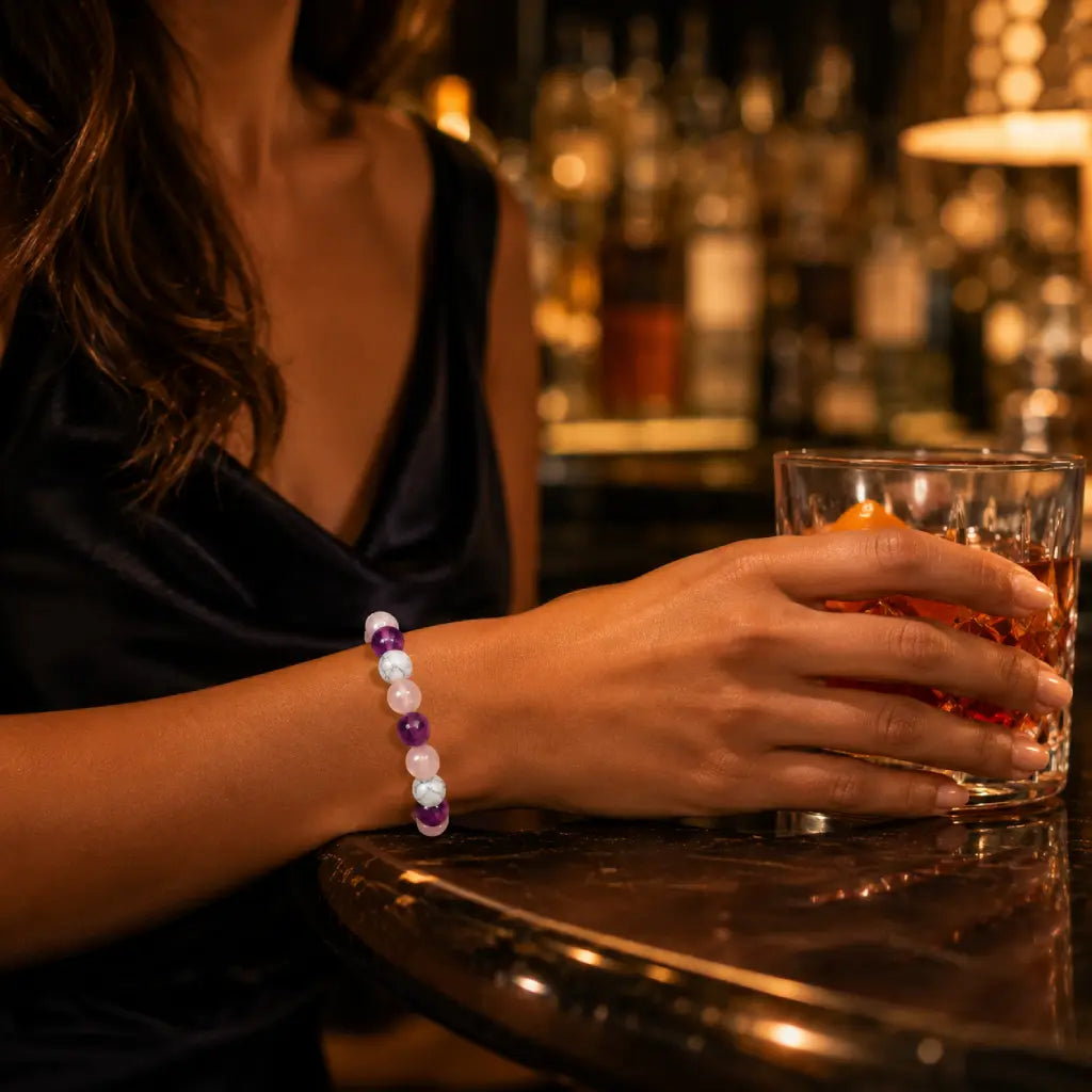 Amethyst-howlite-rose quartz bracelet displayed at dinner for stylish crystal jewelry and elegant wellness appeal.