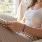 Amethyst jewelry paired with reading moments featuring crystal bracelet for calm energy and relaxing comfort