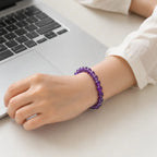 Amethyst jewelry worn at workspace featuring crystal bracelet supporting focus and stylish productivity