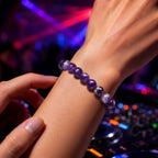 Amethyst jewelry elegant crystal bead bracelet worn at upscale cocktail bar showcasing luxury gemstone fashion and nightlife style