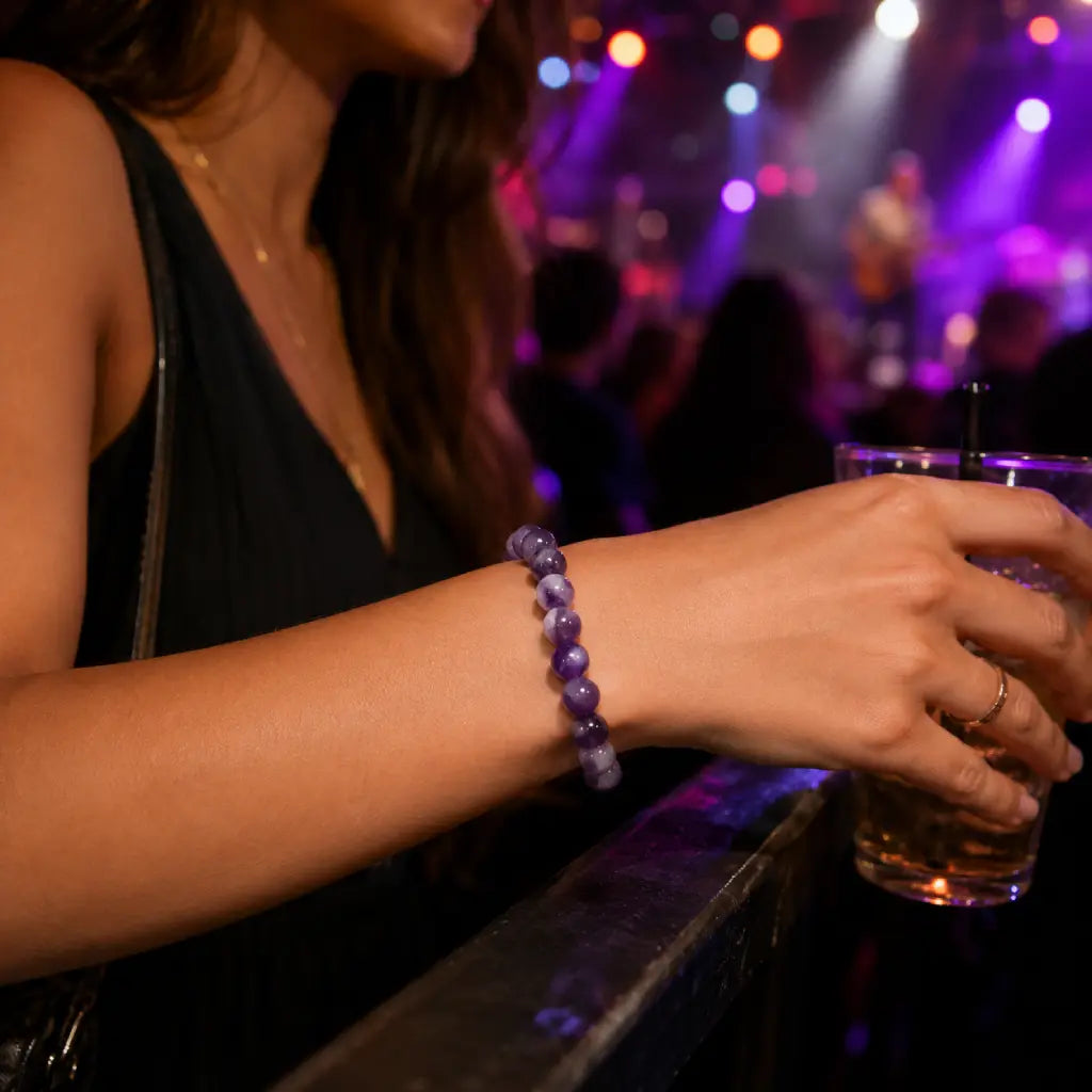 Amethyst jewelry polished crystal bracelet paired with cocktail attire creating chic gemstone fashion for upscale evening events