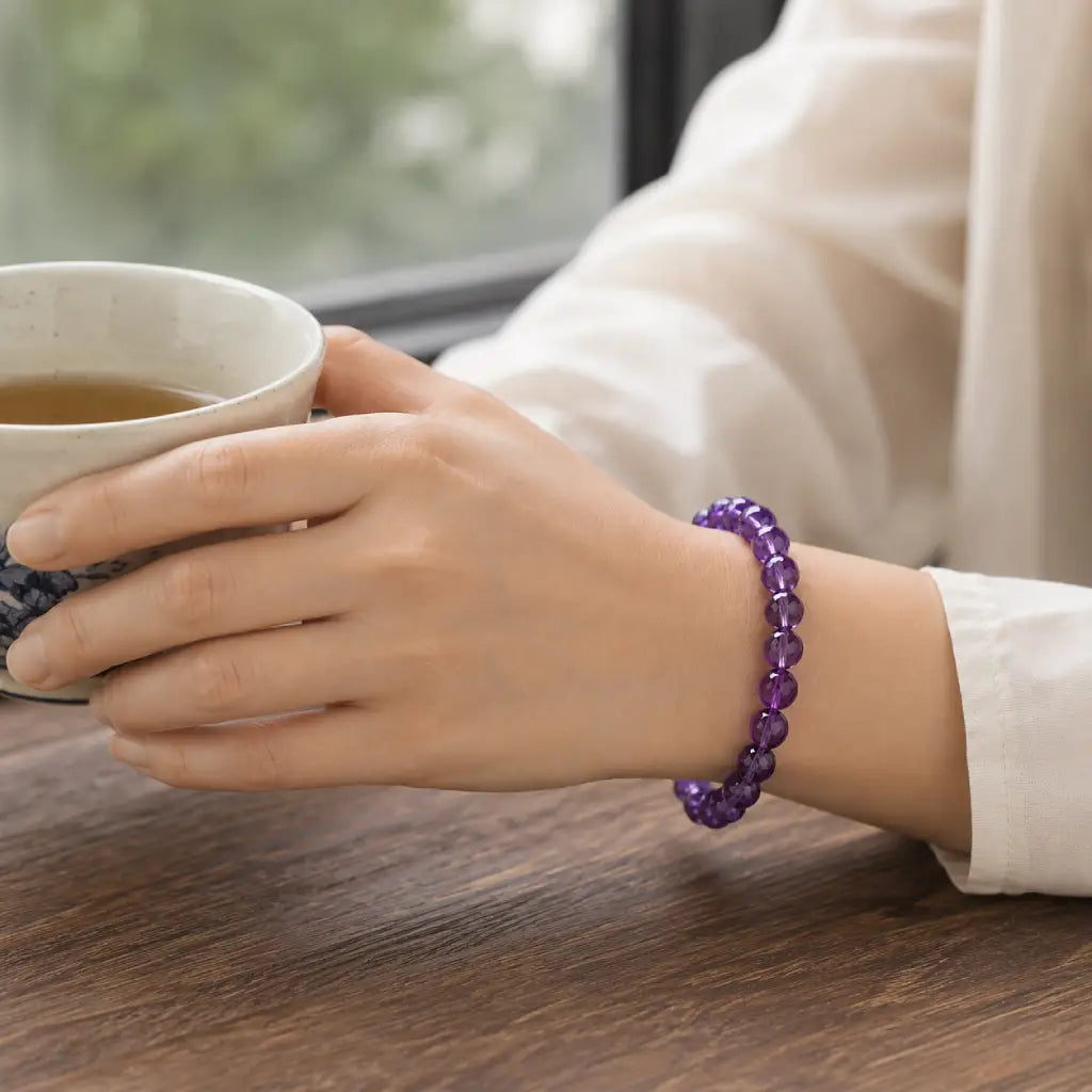 Amethyst jewelry paired with tea moments featuring purple gemstone bracelet for relaxing mindful comfort
