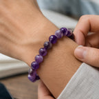 Amethyst jewelry natural gemstone bracelet worn casually on wrist with polished purple crystal beads for stylish daily wear