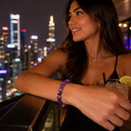 Amethyst jewelry elegant gemstone bracelet worn on rooftop lounge showcasing premium crystal fashion and modern nightlife style