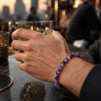Amethyst jewelry masculine crystal bead bracelet worn outdoors featuring natural purple gemstones and rugged modern style