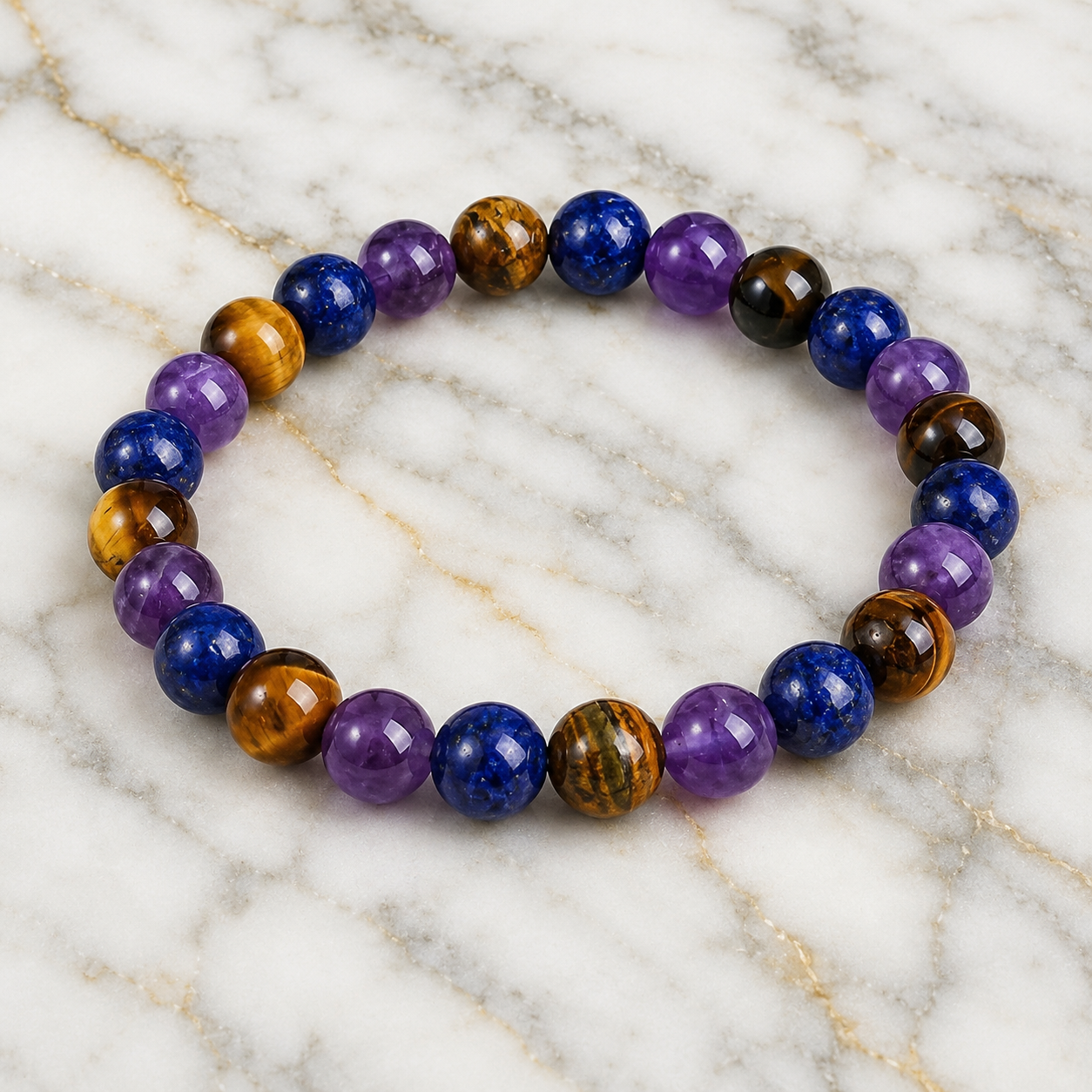 Amethyst Tiger's Eye Lapis Lazuli bracelet on marble with premium gemstone jewelry presentation