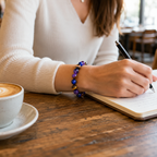 Amethyst Tiger's Eye Lapis Lazuli bracelet while journaling with gemstone focus and calm energy