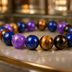 Amethyst Tiger's Eye Lapis Lazuli bracelet close-up featuring polished healing crystal beads and luxury detail