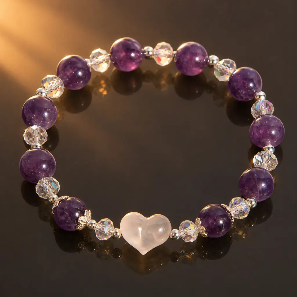 Amethyst white agate bracelet on a reflective surface highlighting polished gemstone beads, crystal spacers and a smooth white heart centerpiece.