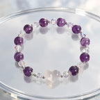 Amethyst white agate bracelet arranged on a clear display stand featuring natural purple gemstone beads and sparkling crystal accents.